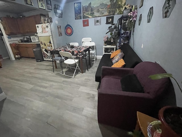 dining area with light wood-style flooring