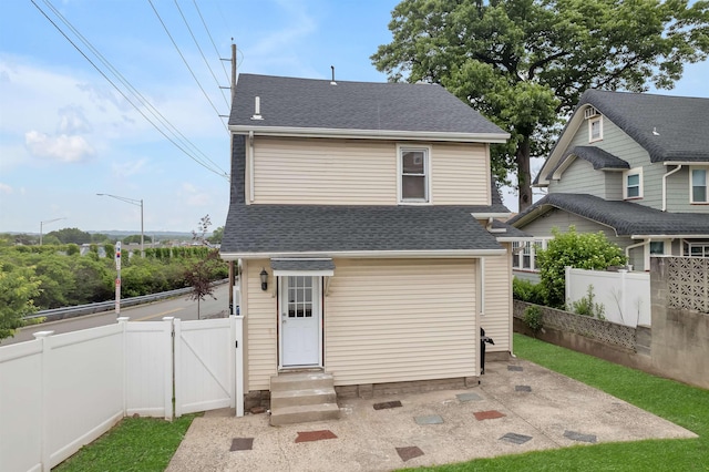 115 Wilson Ave, Rutherford, NJ 07070 - back of house featuring a gate, roof with shingles, entry steps, and a patio area