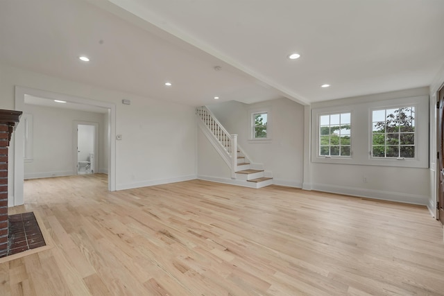 115 Wilson Ave, Rutherford, NJ 07070 - unfurnished living room with light wood finished floors, stairs, baseboards, and recessed lighting