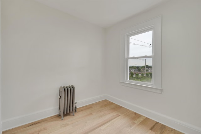 115 Wilson Ave, Rutherford, NJ 07070 - empty room with radiator heating unit, baseboards, and light wood-type flooring
