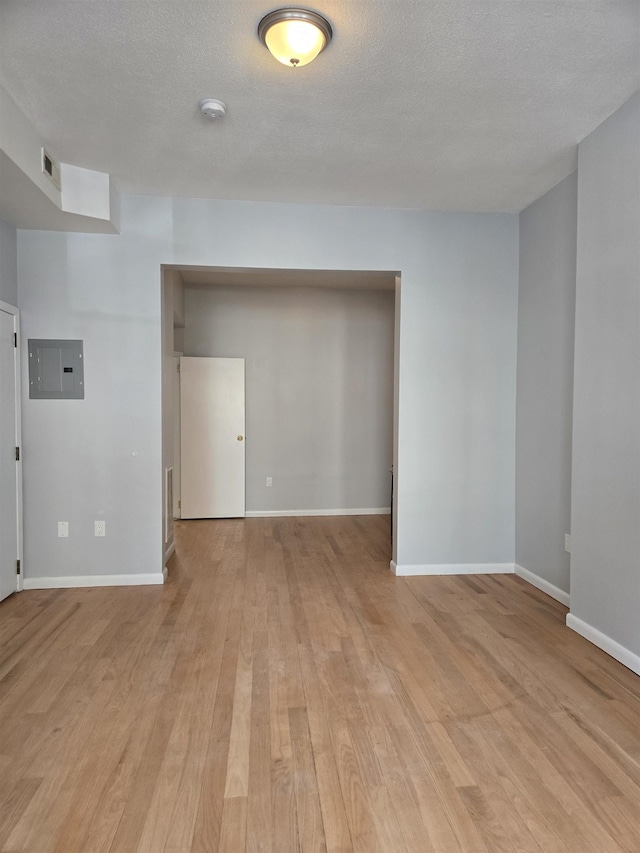 29 48th St, Weehawken, NJ 07086 - spare room featuring baseboards, visible vents, electric panel, and light wood-style flooring