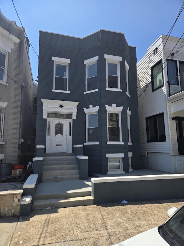 29 48th St, Weehawken, NJ 07086 - view of property featuring brick siding and entry steps