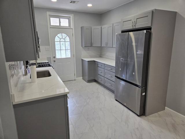 29 48th St, Weehawken, NJ 07086 - kitchen featuring freestanding refrigerator, baseboards, recessed lighting, marble finish floor, and gray cabinets