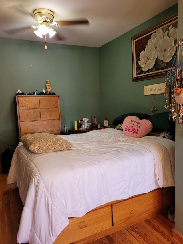 bedroom featuring hardwood / wood-style flooring and ceiling fan