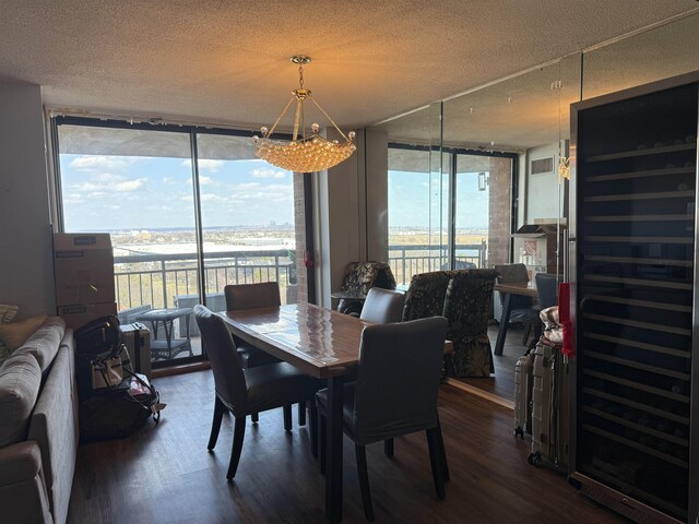 dining area featuring floor to ceiling windows, dark wood-type flooring, and beverage cooler