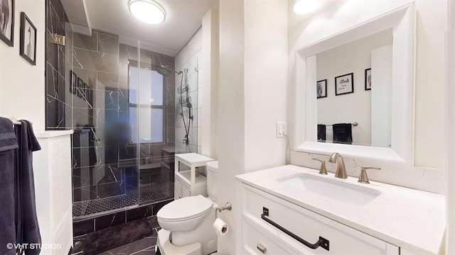 bathroom with tile patterned flooring, vanity, an enclosed shower, and toilet