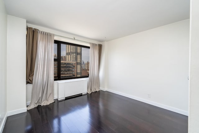 135 Montgomery St Unit 21H, Jersey City, NJ 07302 - empty room with dark wood-type flooring and baseboards