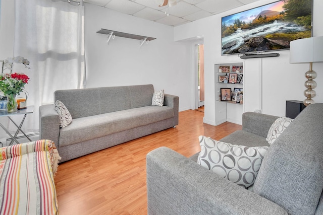9 E 15th St, Bayonne, NJ 07002 - living area with a drop ceiling, wood finished floors, and a ceiling fan