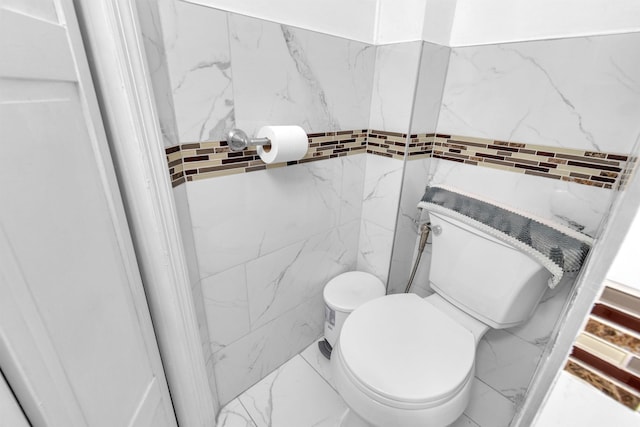 9 E 15th St, Bayonne, NJ 07002 - bathroom featuring tile walls and marble finish flooring
