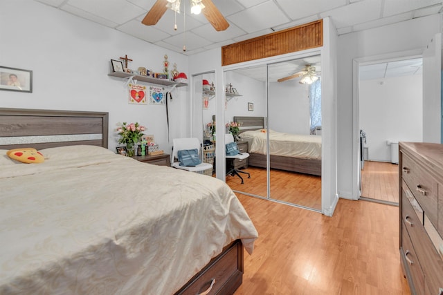 9 E 15th St, Bayonne, NJ 07002 - bedroom featuring a drop ceiling, light wood-style floors, and ceiling fan