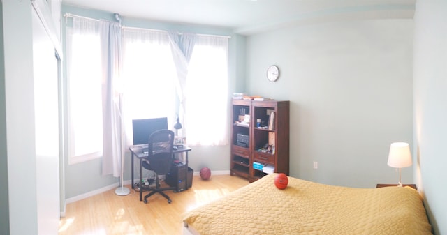 bedroom with hardwood / wood-style floors