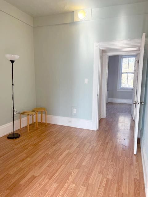 empty room with light hardwood / wood-style floors