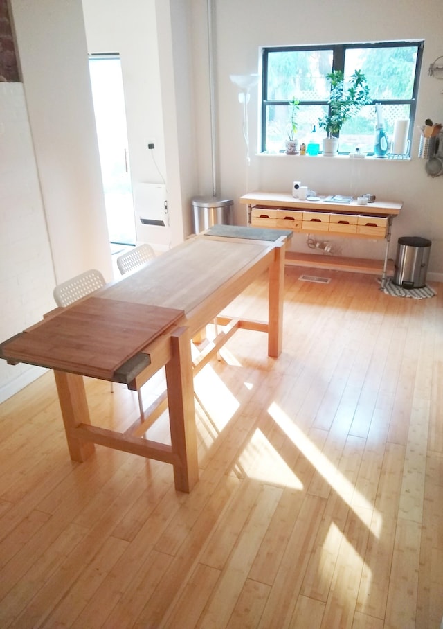 unfurnished dining area featuring light hardwood / wood-style floors