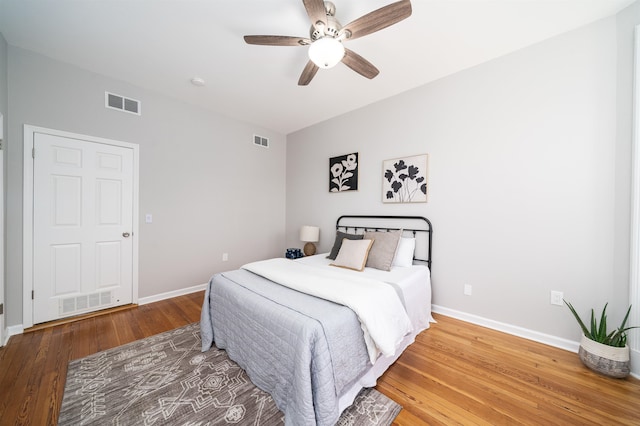 bedroom featuring hardwood / wood-style flooring and ceiling fan