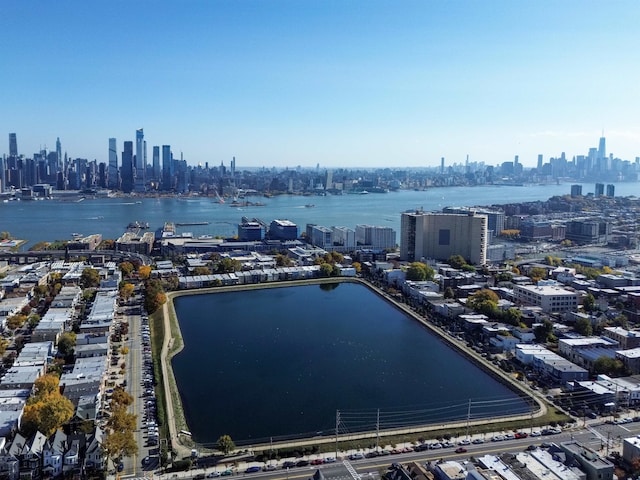 birds eye view of property featuring a water view