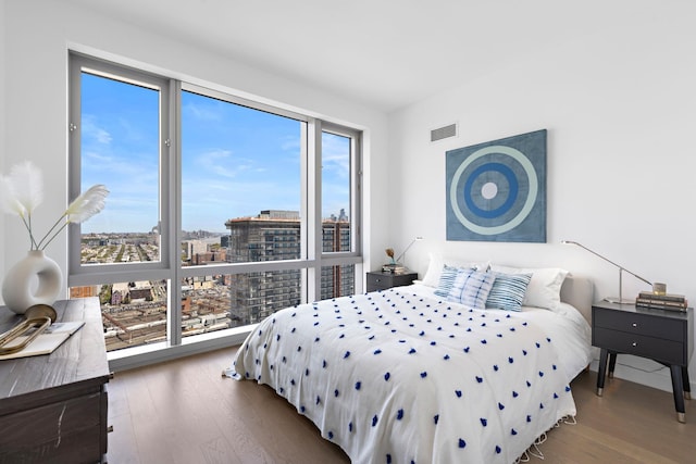 75 Park Ln S Unit 3402, Jersey City, NJ 07310 - bedroom featuring wood finished floors and a city view