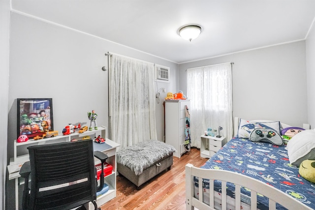 bedroom with hardwood / wood-style flooring