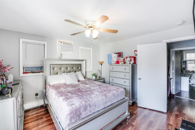 bedroom with a wall mounted AC, ceiling fan, and dark wood-type flooring