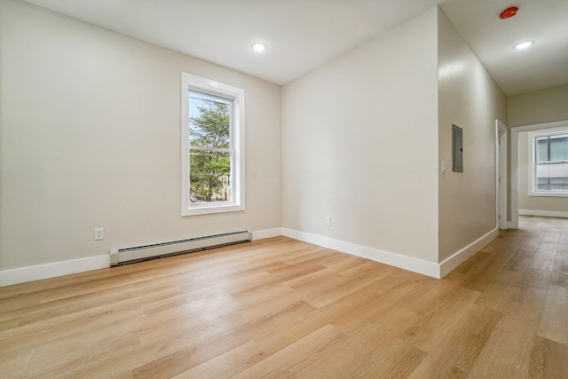 450 1st St Unit 2, Hoboken, NJ 07030 - unfurnished room featuring a baseboard radiator, light wood-style flooring, baseboards, electric panel, and recessed lighting