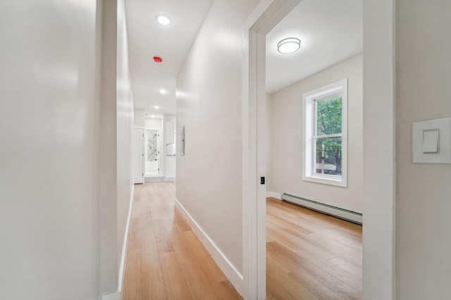 450 1st St Unit 2, Hoboken, NJ 07030 - hall with baseboard heating, light wood finished floors, baseboards, and recessed lighting
