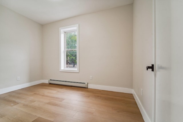450 1st St Unit 2, Hoboken, NJ 07030 - spare room featuring a baseboard radiator, light wood-style flooring, and baseboards