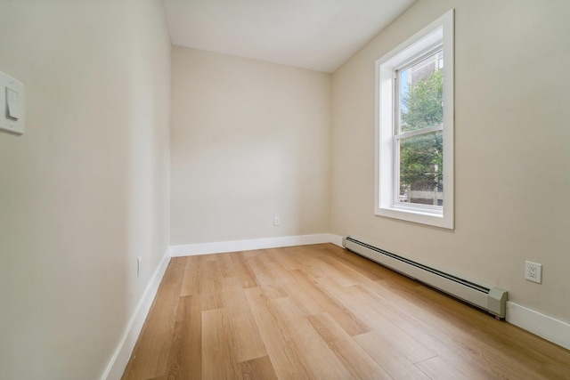 450 1st St Unit 2, Hoboken, NJ 07030 - empty room with baseboard heating, wood finished floors, and baseboards