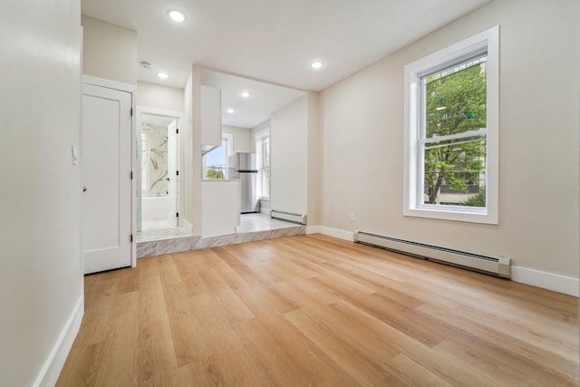450 1st St Unit 2, Hoboken, NJ 07030 - spare room featuring a baseboard heating unit, baseboard heating, wood finished floors, baseboards, and recessed lighting