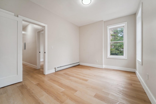 450 1st St Unit 2, Hoboken, NJ 07030 - spare room with baseboard heating, light wood-style flooring, and baseboards