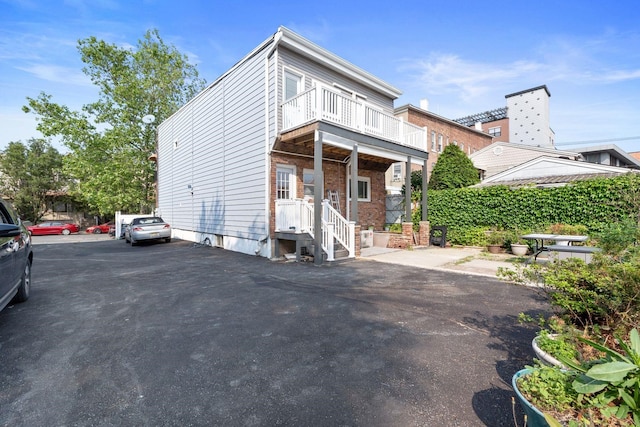 82 E 24th St, Bayonne, NJ 07002 - back of house with a balcony
