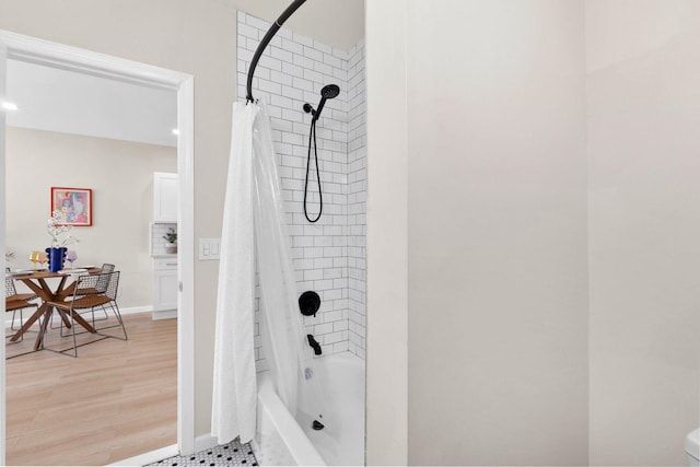 82 E 24th St, Bayonne, NJ 07002 - bathroom with shower / bath combination with curtain, baseboards, and wood finished floors