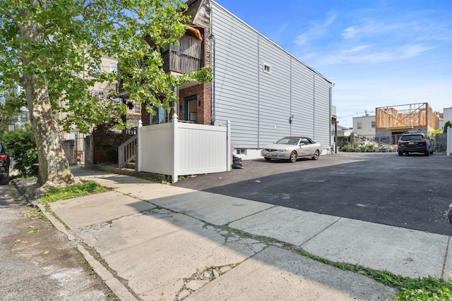 82 E 24th St, Bayonne, NJ 07002 - view of side of property with uncovered parking
