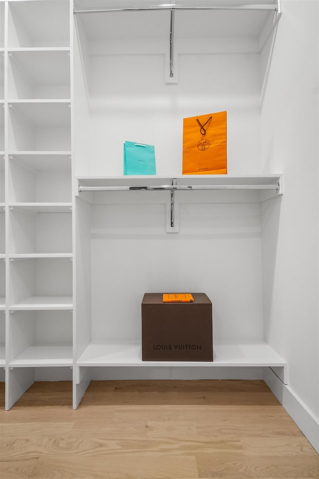 spacious closet featuring wood finished floors