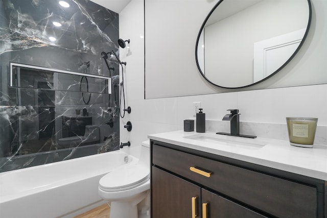 full bathroom with toilet, bathtub / shower combination, tile walls, and vanity