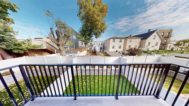 balcony featuring a residential view