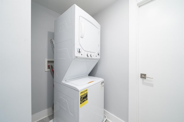 21 Hancock Ave Unit 1, Jersey City, NJ 07307 - laundry room featuring stacked washer and clothes dryer and baseboards