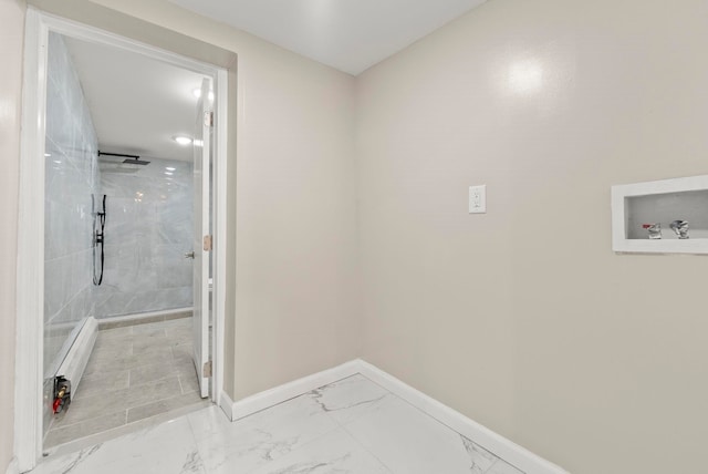 laundry room featuring laundry area, marble finish floor, baseboards, and washer hookup