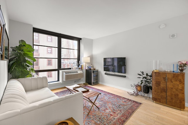 living room featuring wood finished floors and baseboards