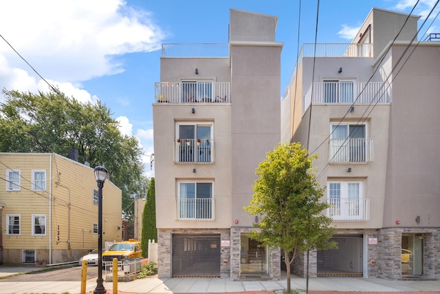 137 20th St Unit B, Union City, NJ 07087 - view of property with a garage and concrete driveway