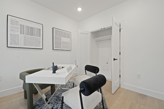 office space with light wood-style flooring, recessed lighting, and baseboards