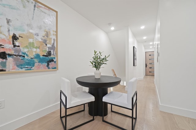 dining area with recessed lighting, baseboards, and light wood finished floors