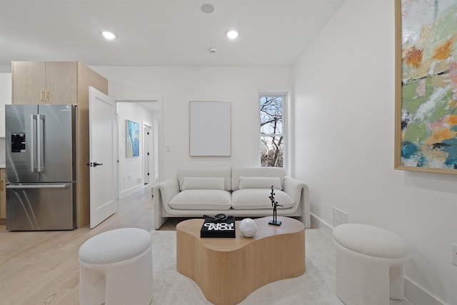 living area with visible vents, recessed lighting, baseboards, and light wood finished floors