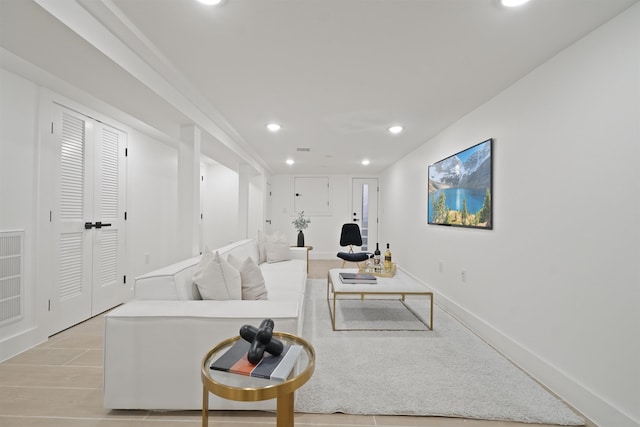 living room featuring recessed lighting and baseboards