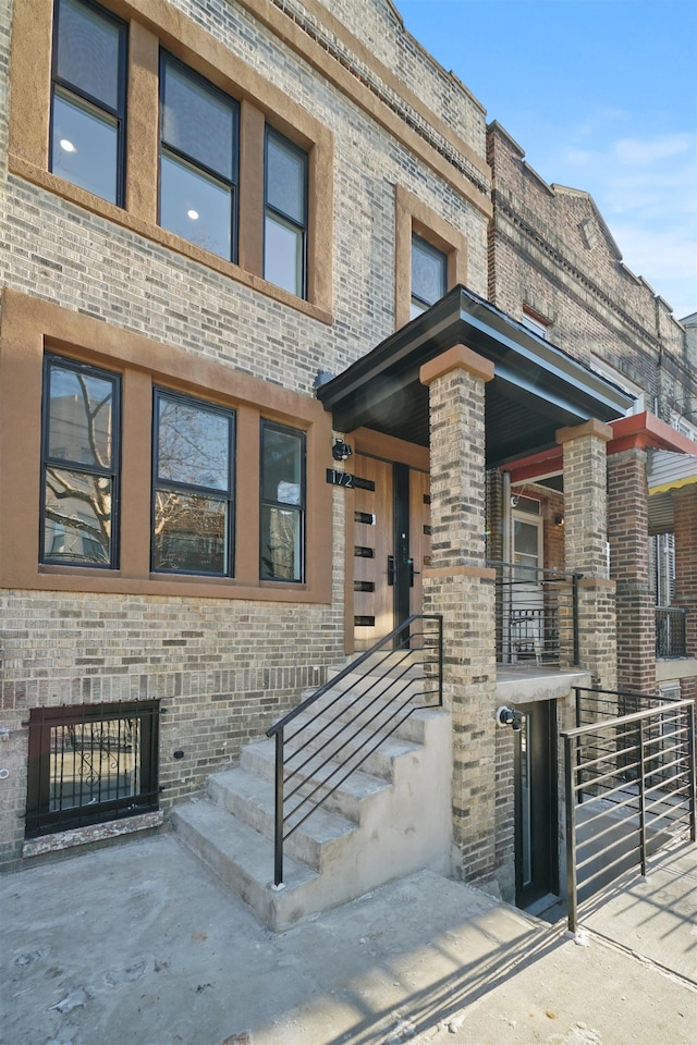 exterior space with brick siding