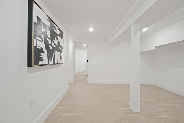 interior space featuring recessed lighting and baseboards