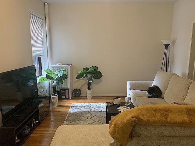 living area with dark wood finished floors and baseboards