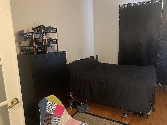 bedroom featuring wood finished floors