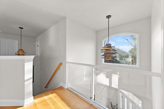 staircase featuring wood finished floors