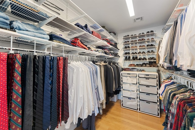 spacious closet featuring visible vents and wood finished floors