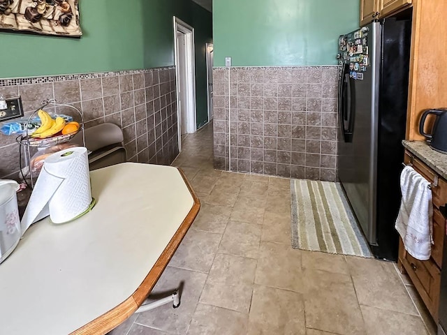 151 Audubon Ave, Jersey City, NJ 07305 - bathroom featuring a wainscoted wall, tile patterned floors, and tile walls
