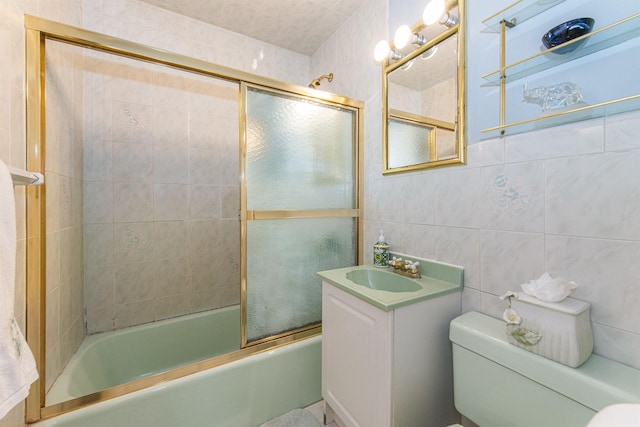 20 Bryant Ave, Bloomfield, NJ 07003 - bathroom featuring shower / bath combination with glass door, vanity, and tile walls